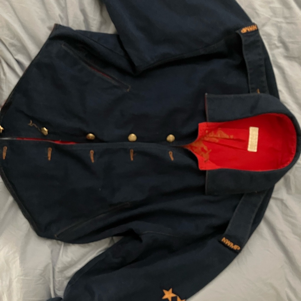 Moda Donna Blue denim with red lining. No size tag- on it, it’s medium large.